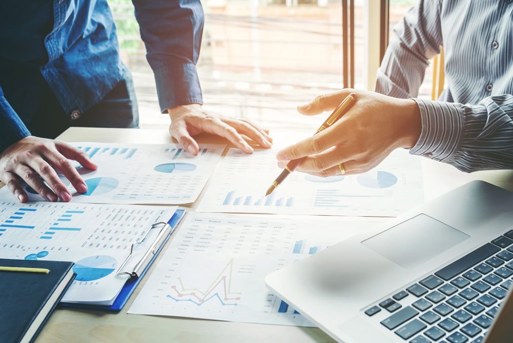 Tax advisory and planning discussion with financial reports